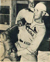 Dizzy Dean celebrates in pith helmet with toy tiger.